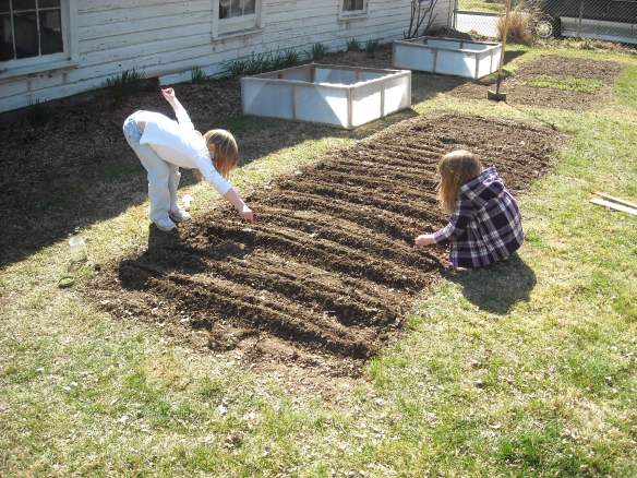 Two girls planting